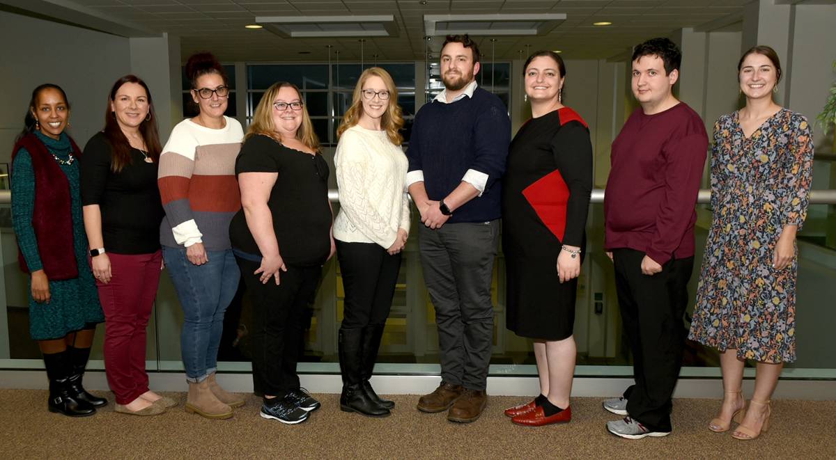 From left: Spire Advisors Monica Brown-Hodkinson and Jenny Lewis; Spire inductees Kim Clark, April Holeck, Laura Malagese, John Bessette, Tzina Klein, and Matthew Thomas; Spire Advisor Samantha Johnston