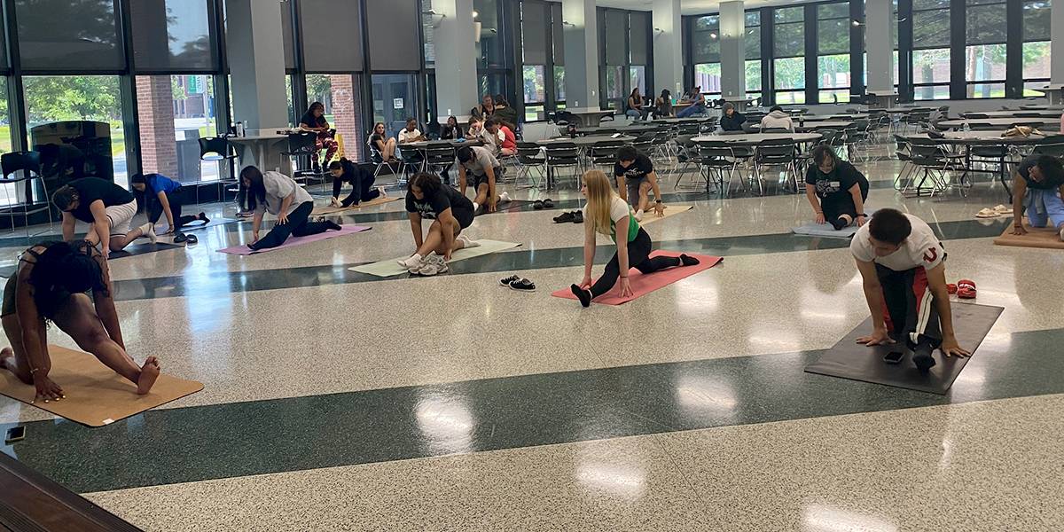 eop students on mats doing yoga