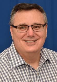 Headshot of Dennis Gibbons