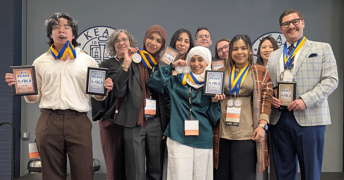 Student members of the MVCC FBLA stand together holding their awards